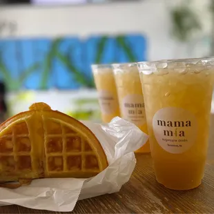 a waffle sandwich and a drink