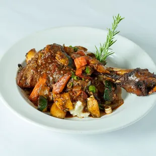 a plate of meat and vegetables