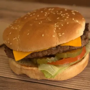 a hamburger with cheese and lettuce