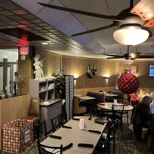 a dining room with tables and chairs