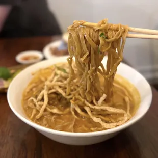 Chiang Mai (Khao Soi): Thai curry noodles w/ slow braised beef rib, crispy noodles, house pickle, red onion | $18