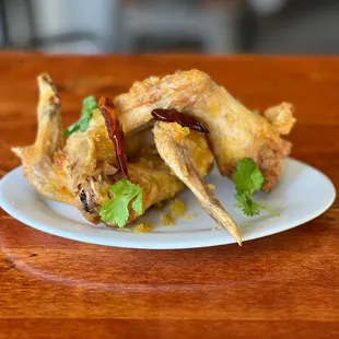 Mama Mu's Wings : Deep fried chicken wings Peek Gai Tod sauteed with our homemade pineapple and chilis