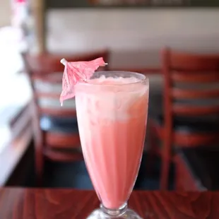 a pink drink in a glass
