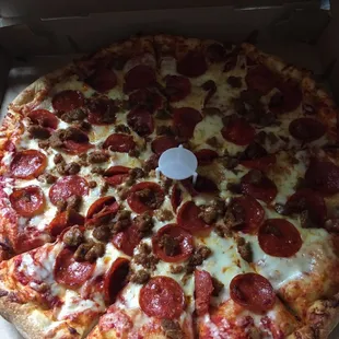 a pepperoni pizza in a box