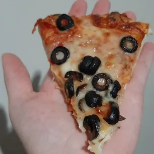 a piece of a small pizza, definitely a personal size pizza