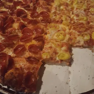 Clearly no pepperoni,bell pepper,bacon on the banana pepper half... which the lady who ordered the pizza doesn't even like to smell