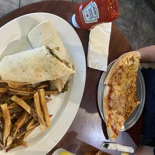 Cheese steak Steak and Cheese Wrap with Italian Fries Lunch Special and  2 Slices of Pizza and Soda Lunch Specials.