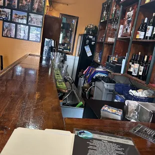 a bar with a menu on the counter