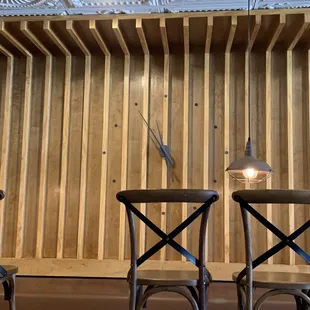 three chairs and a clock