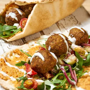 a pita with meatballs and vegetables