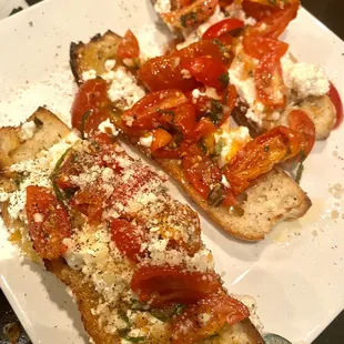 The goat cheese bruschetta ( sorry missing one piece) really fresh and delicious. $10.95 HH