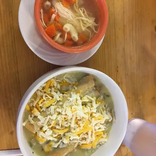 two bowls of soup on a table