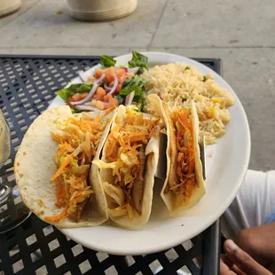 a plate of tacos and rice