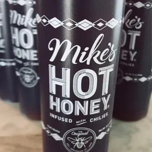 a close up of a cup of hot honey