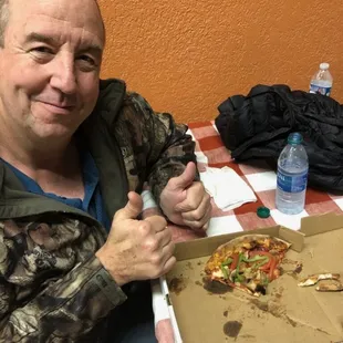 a man giving a thumbs up