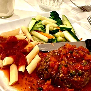 a plate of pasta and meatballs