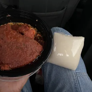 a person holding a bowl of food