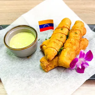 On of our most popular starters, TEQUEÑOS, mozarella enveloped in a venezuelan breading.
