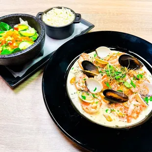 A carribean inspired Chef specialty comprised of a mix of sauteed shrimp and octopus bathed in coconut milk, habanero pepper.