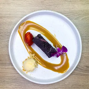 North American style brownie, baked with almonds and served with chocolate ganache, house-made caramel sauce.