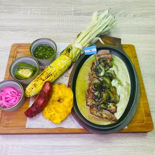 15 oz NY Steak, grilled to a recommended medium and served with chimichurri, spicy peppers, cabbage slaw, fries, &amp; Mamacitas Aioli.