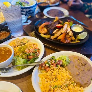 Beef, shrimp, and chicken fajita entree with rice and beans