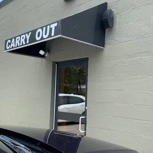 On the side by parking lot