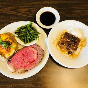 8 ounce prime rib cooked medium rare with a loaded baked potato and green beans. . The bread pudding was homemade by the owner and divine