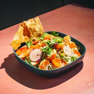 Crunchy Cabbage Salad featuring: locally farmed carrots and daikon, asian pear, candied cashews, Hodo tofu cracker, and sesame!