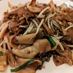 Chow Kway Teow. $13. Penang&apos;s famous wok-fried flat rice noodles with squid, egg, and bean sprouts. I requested no shrimp in this one.