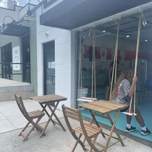 Cute outside seating. Love the swings!