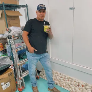 a man holding a smoothie