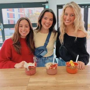 three women sitting at a table
