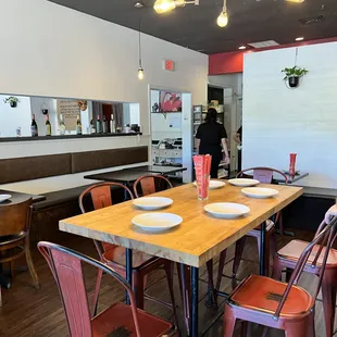 a dining room with tables and chairs