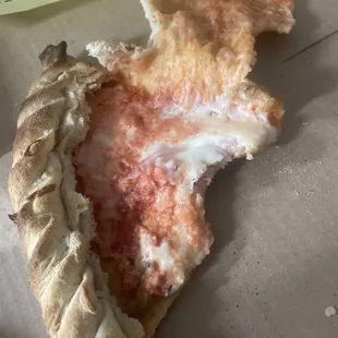 The inside of the calzone sorry the bite taken
