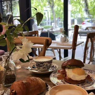 breakfast sandwich, seasonal honey cappuccino, chocolate croissant