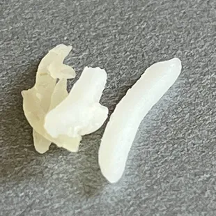 Hard and dried up pieces of rice mixed in with cooked rice