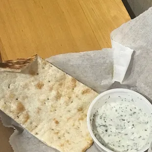 Handmade, fresh flatbread with yogurt herb dipping sauce.