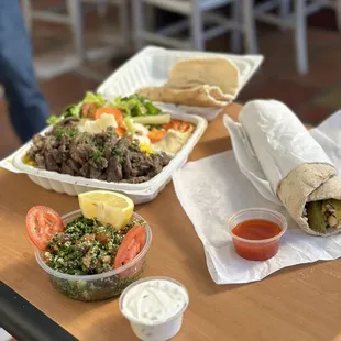 All the food we ordered. Garlic Chicken Wrap and Beef Shawarma Plate with Tabouli salad