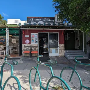 bicycles parked in front of the store