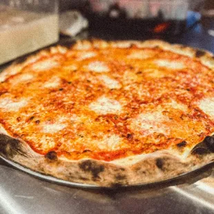 a cheese pizza on a table