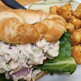 Homemade chicken salad on a large flaky croissant