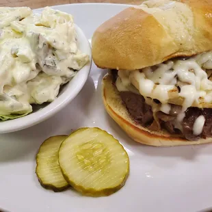 Tenderloin Sandwich smothered with sautéed mushrooms, onions, and melted mozzarella cheese