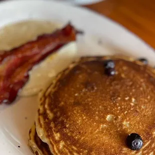 Buttermilk Pancakes with blueberries and crispy bacon