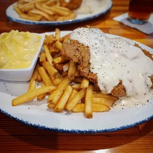 Chicken fried steak with fries and mac and cheese
