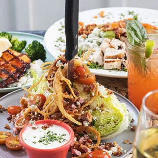 Mama's Famous Wedge Salad with blue cheese crumbles, cherry tomatoes, bacon bits &amp; blue cheese dressing.