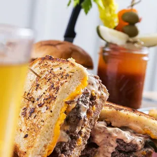 All-American Beach Melt! Over one pound of handmade char-grilled patties, melted All-American cheese, on toasted sourdough, grilled onions.