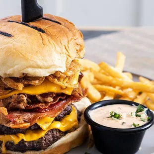 "The Monster" Over a pound of char-grilled  beef,  4 slices American cheese, bacon, fried onion strings and Mama's special sauce