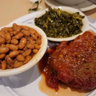 Meatloaf, collard greens, baked beans and a salad.