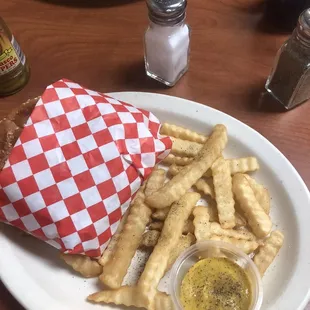 a plate of french fries and eggs